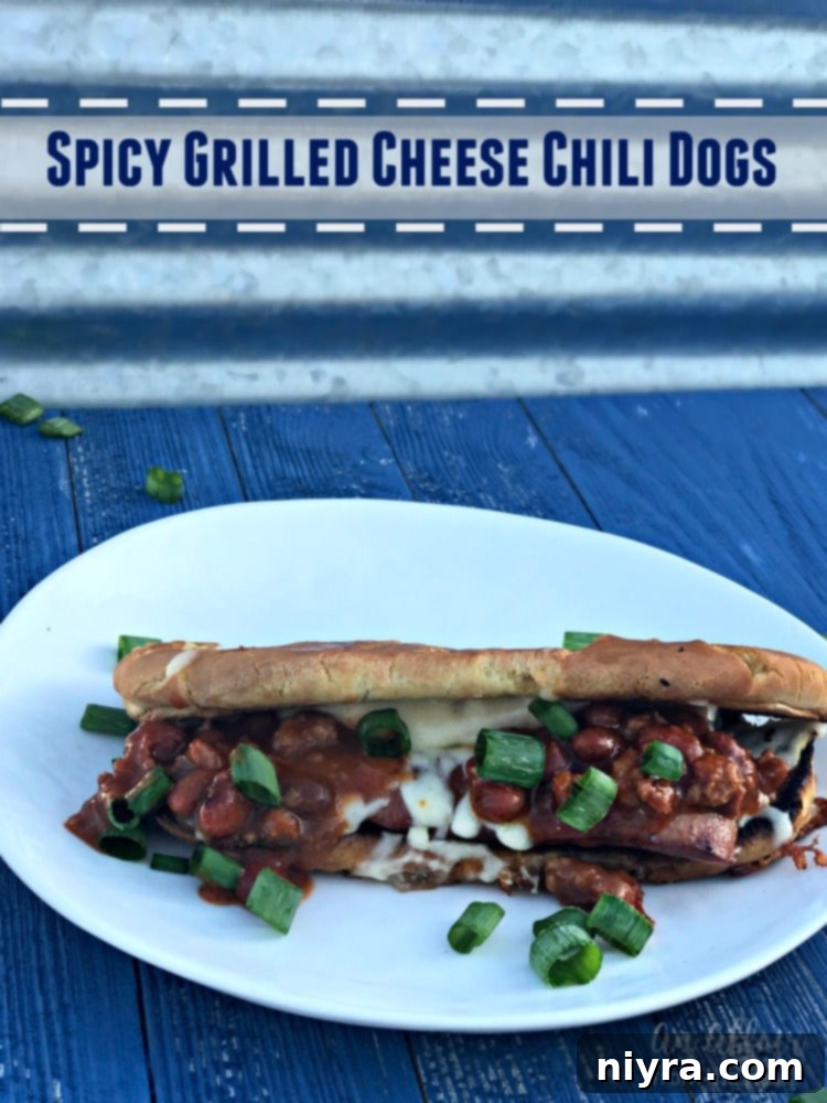 Spicy Grilled Cheese Chili Dogs beautifully arranged on a rustic wooden board, ready for serving at a lively summer party.