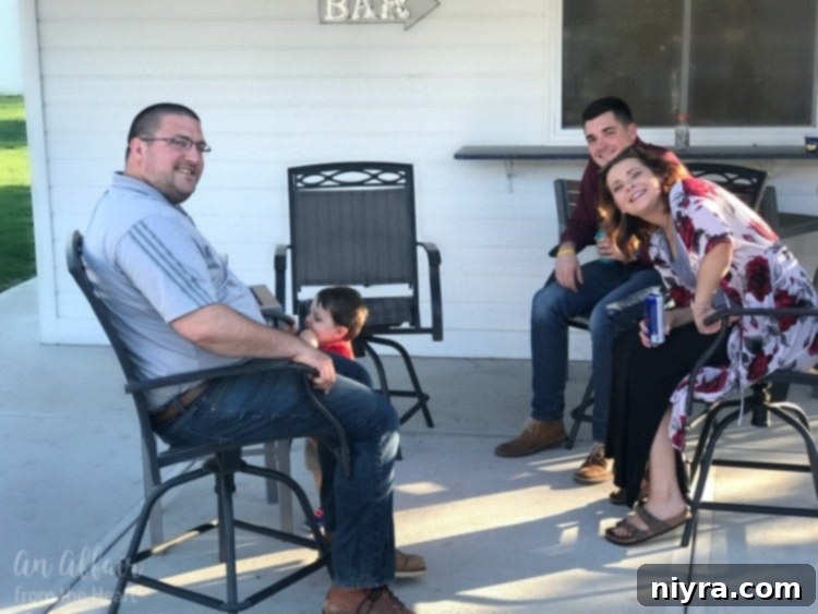 A vibrant scene of family and friends gathering on a sunny patio, enjoying an outdoor meal and conversation, capturing the essence of summer hospitality.
