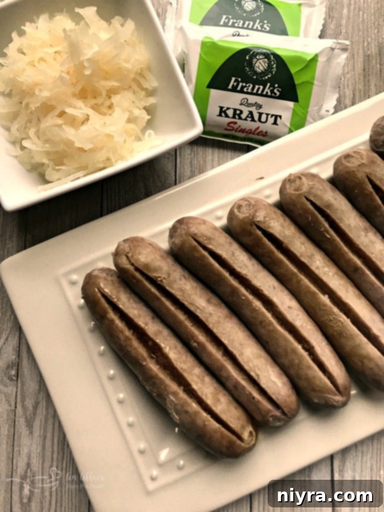 Kraut Stuffed Bacon Wrapped Brats, cut and ready for the grill