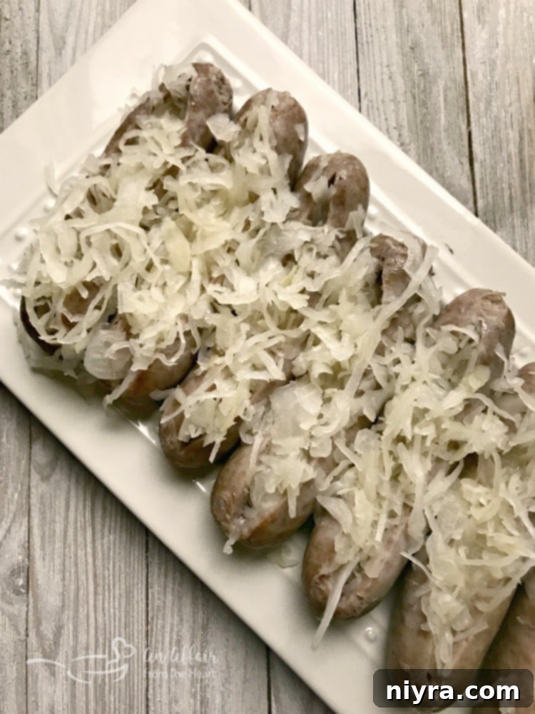 Kraut Stuffed Bacon Wrapped Brats generously stuffed with Frank's Kraut