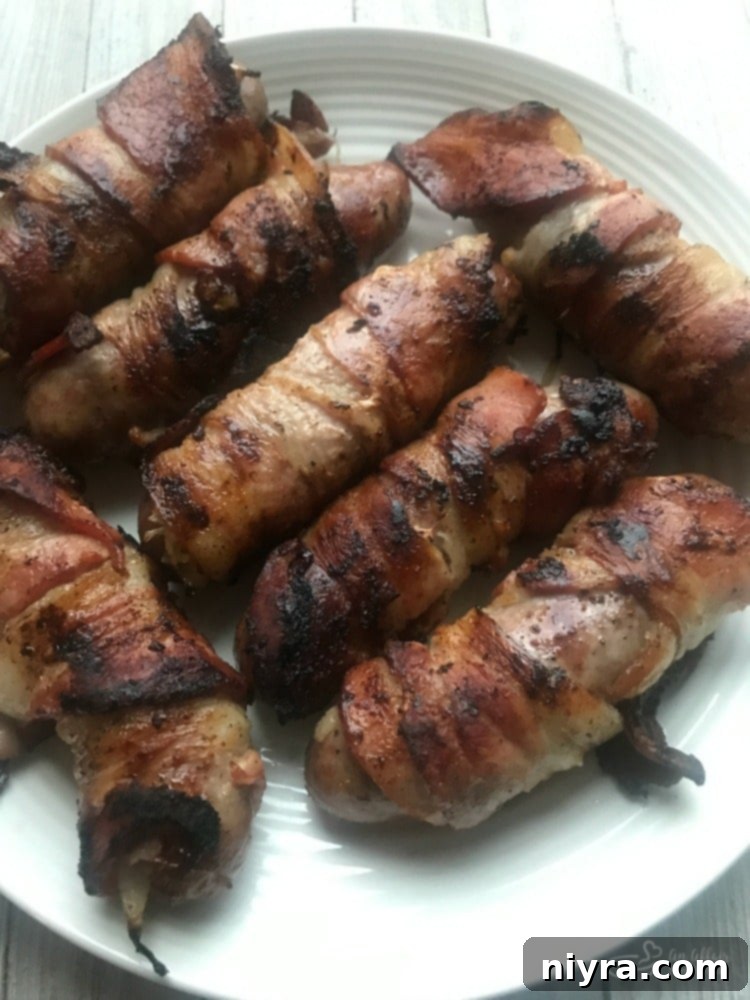 Kraut Stuffed Bacon Wrapped Brats plated beautifully, ready to serve