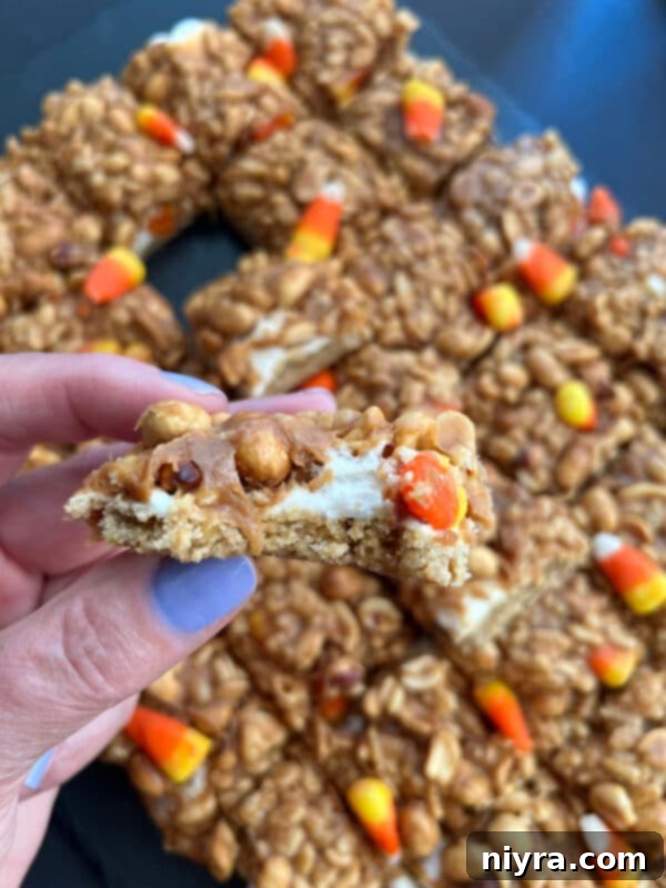 A festive platter of Candy Corn Salted Nut Roll Bars, ready for a fall gathering.