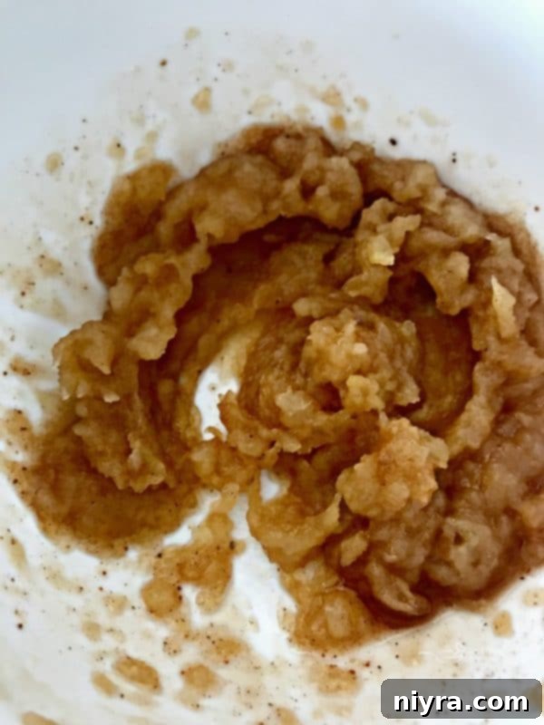 Pureed baked apple cooling in a bowl