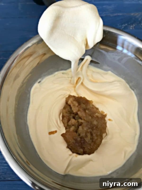 Chilled apple puree added to blended vanilla ice cream