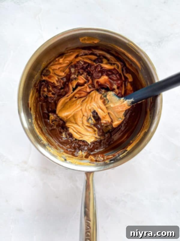 Triple Layer Chocolate Caramel Delight 8 Caramel poured over the first cracker layer, with a second layer of crackers being added on top.