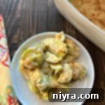 Overhead view of Brussels Sprouts Gratin on a white plate
