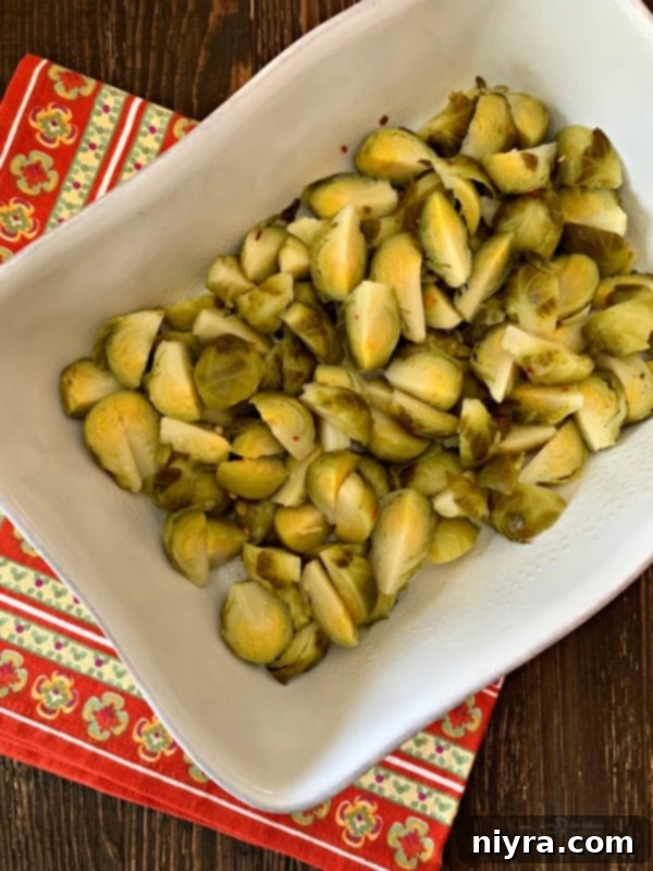 Draining and quartering Paisley Farm Hot Brussels Sprouts for gratin