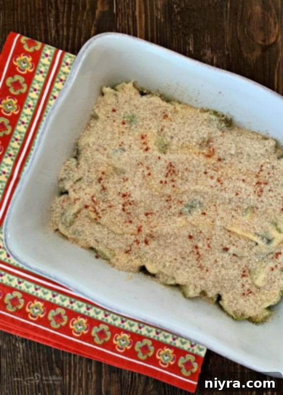 Sprinkling breadcrumbs and paprika over Brussels Sprouts Gratin