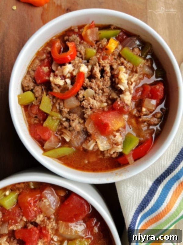 Unstuffed Pepper Soup 2 Two bowls of hearty Stuffed Pepper Soup, garnished with fresh parsley.