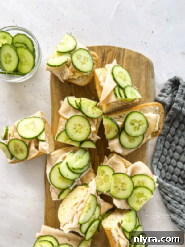 Crisp Cucumber Ranch Salad 10 Turkey Ranch Baguettes on a wood board, a dish that pairs well with cucumber salad.
