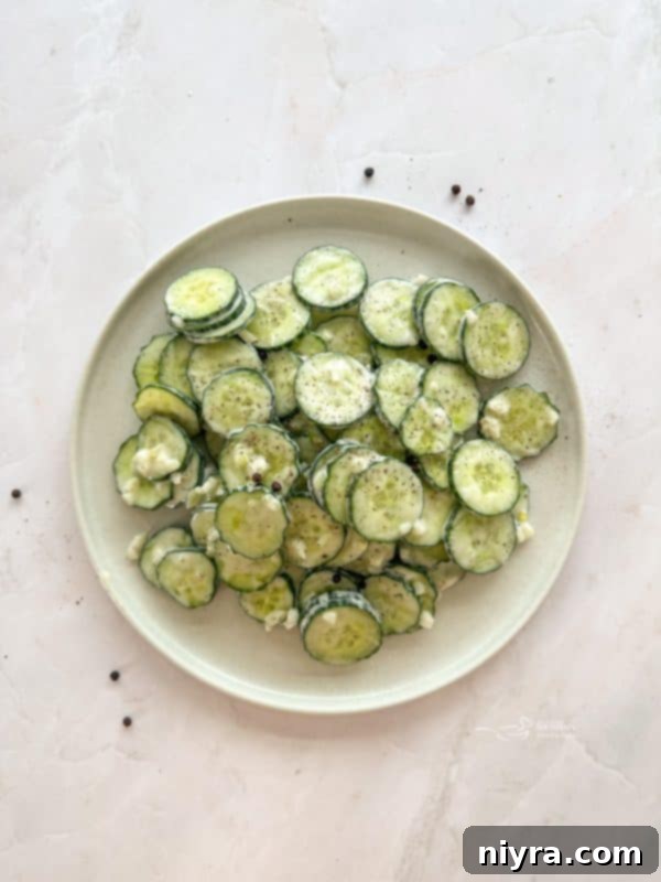 Crisp Cucumber Ranch Salad 3 Close-up of crispy cucumber slices in ranch dressing.