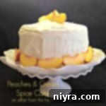 Side view of Peaches & Cream Spice Cake on a white cake dish with text 'peaches & cream spice cake'