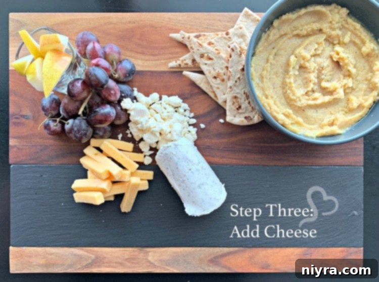 Step three of building a Mediterranean Cheeseboard: adding cheeses