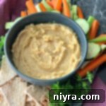 Cauliflower Hummus in a blue bowl