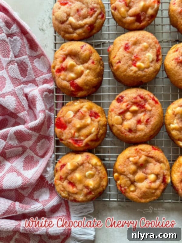 Sweet Cherry White Chocolate Delights 18 White Chocolate Cherry Cookies on a festive red napkin, perfect for holiday baking