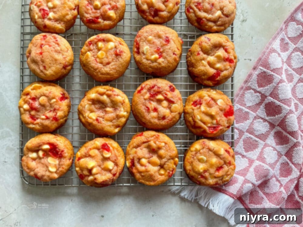 Sweet Cherry White Chocolate Delights 5 Many White Chocolate Cherry Cookies cooling on a wire rack