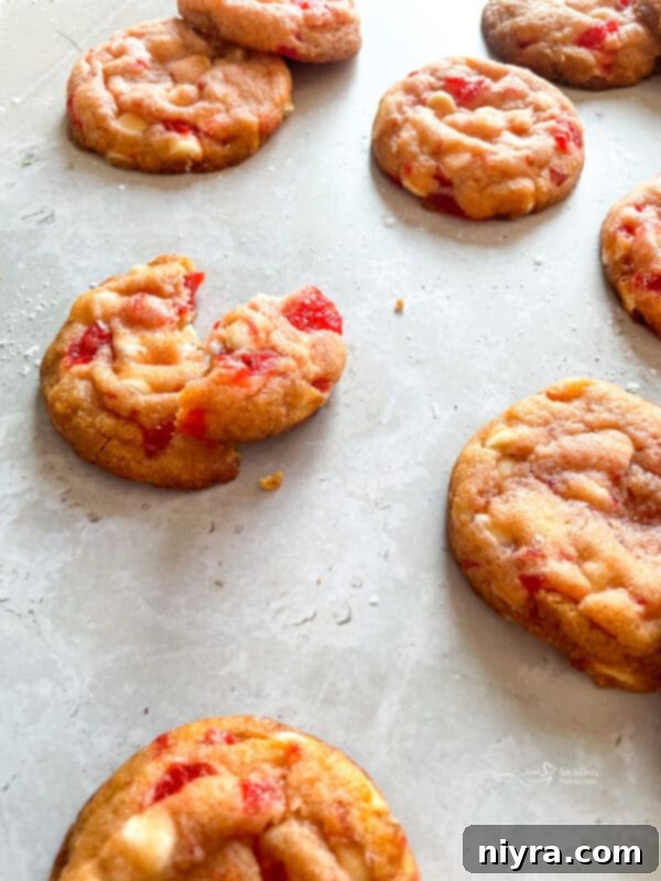 Sweet Cherry White Chocolate Delights 8 Ingredients for White Chocolate Cherry Cookies laid out, including cherries and chocolate chips