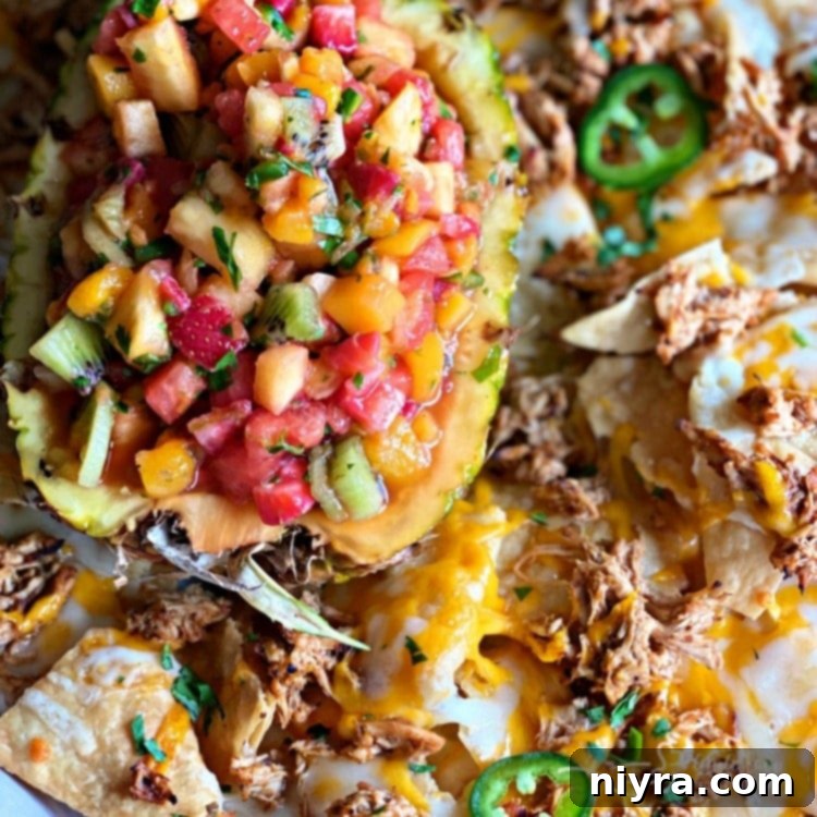 Fresh Tomato Salsa 11 Close up of Tropical Chicken Nachos with Tropical Salsa, garnished with cilantro.