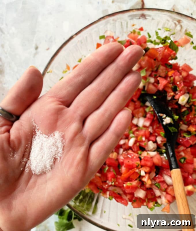 Fresh Tomato Salsa 7 Mixed ingredients for Pico de Gallo in a large bowl, before adding lime juice and salt.