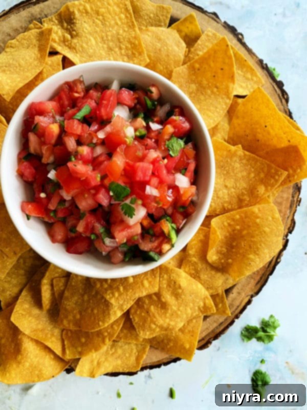 Fresh Tomato Salsa 10 Vibrant Pico de Gallo in a white bowl, ready to be served.