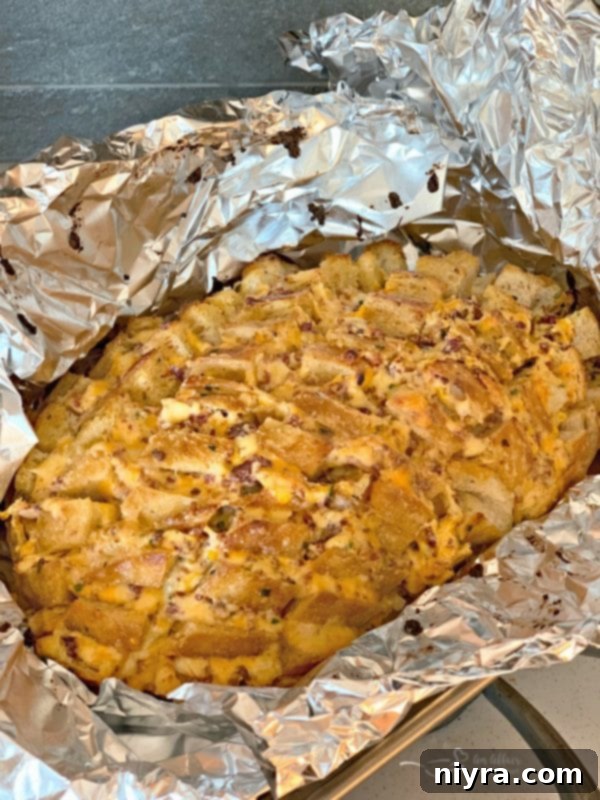 Wrapped Dorothy's Cheesy Bacon Pull-Apart Bread ready for baking