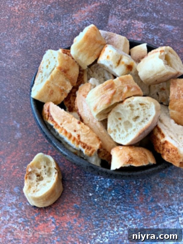 Preparing bread to make homemade croutons.