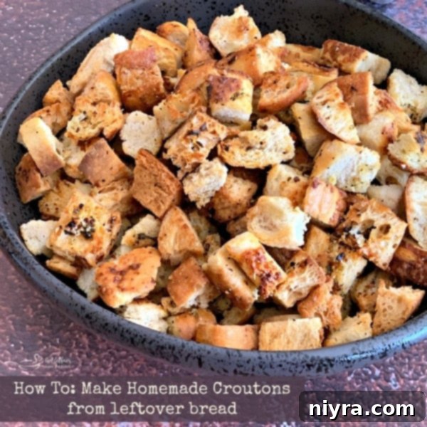 A bowl of fresh, crispy homemade croutons ready to eat.