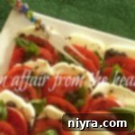 Close up of mozzarella and tomatoes on a white platter