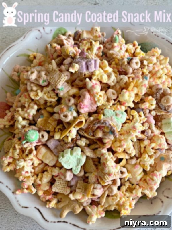 Sweet Springtime Medley 12 Overhead view of a large bowl of Spring Candy Coated Snack Mix, adorned with sprinkles and pastel candies.