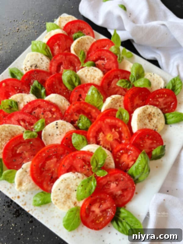 Vibrant Caprese Salad with red tomatoes, white mozzarella, and green basil
