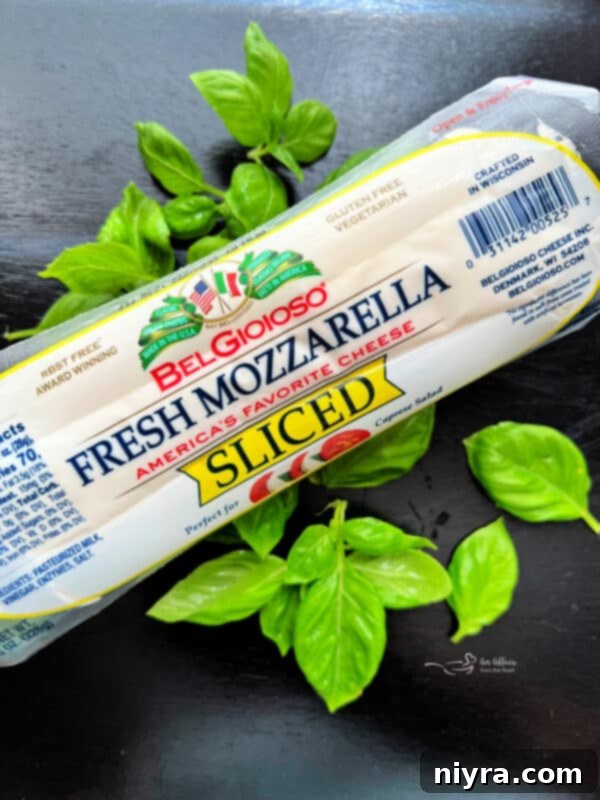 Slicing fresh mozzarella for Caprese salad