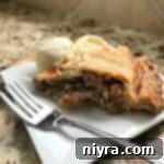 Old-Fashioned Rhubarb Pie 16 Grandma's Rhubarb Pie on a white plate with a fork