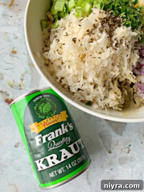 Ingredients for sauerkraut stuffing being prepared with a can of Frank's Kraut visible.