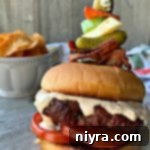 Bloody Mary Burger with garnish on grey platter