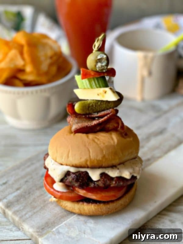 Bloody Mary Burger with garnish on grey platter