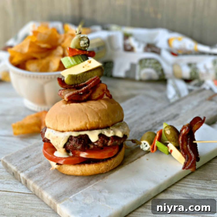 Bloody Mary Burger with garnish on grey platter