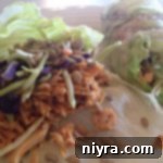 Spicy Buffalo Chicken Lettuce Wraps 2 Close up of lettuce wraps with text "buffalo chicken lettuce wraps"