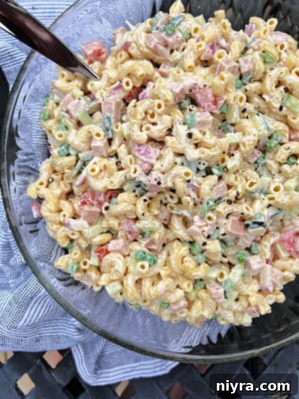 Hearty Spam Pasta Salad 2 A vibrant bowl of Spam pasta salad, ready to be served at a cookout.