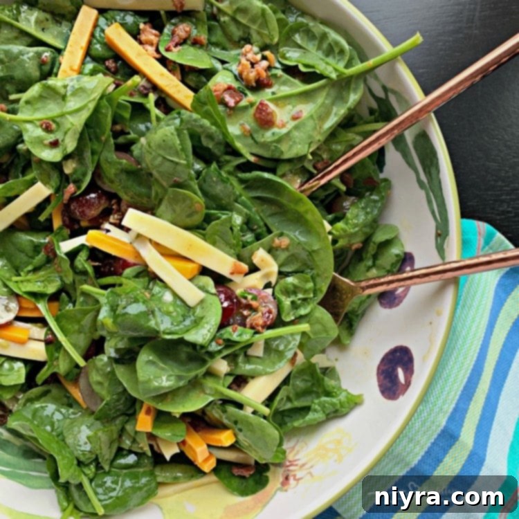 Silverglade Harvest Spinach Salad 7 Silverglade Spinach Salad fully tossed with bacon Dijon dressing, ready to be served