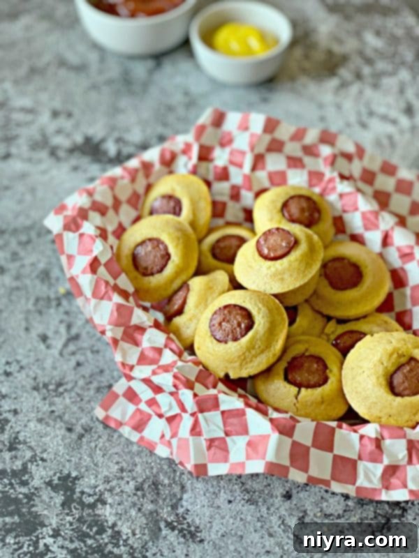 A stack of Corn Dog Mini Muffins on a plate, ready to be served