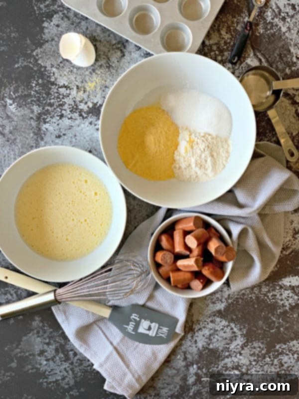 Dry ingredients being whisked in a bowl for Corn Dog Mini Muffins