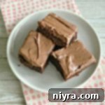 overhead of Frosted Zucchini Brownies on a white plate