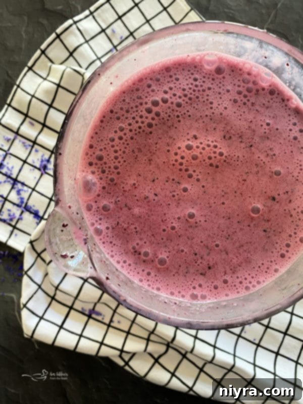 Top view of blended purple cow smoothie in blender – perfectly smooth