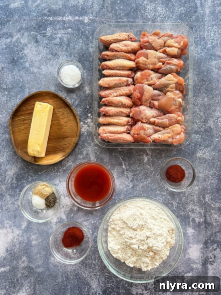 Crispy Hooters Style Air Fryer Wings 5 Step-by-step image of wings being coated for air fryer