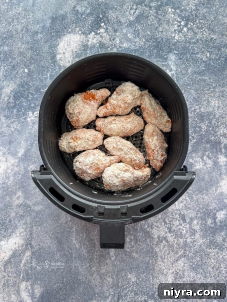 Crispy Hooters Style Air Fryer Wings 10 Fourth step: placing coated wings in a single layer in the air fryer basket