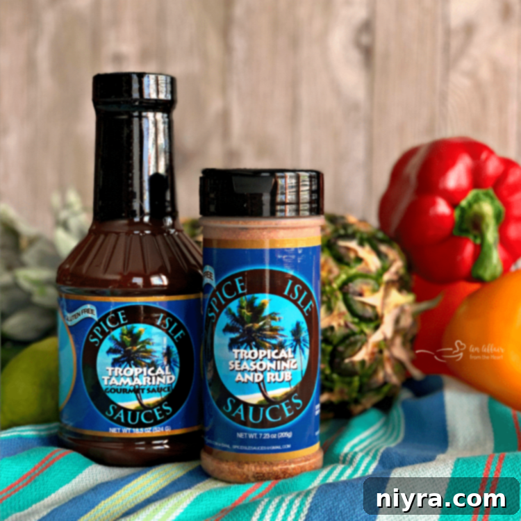 Spice Isle Tropical Tamarind Sauce bottle, highlighting its rich, flavorful profile for Caribbean-inspired dishes.