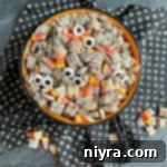 Overhead of Halloween Double Peanut Butter Muddy Buddies in a halloween bowl