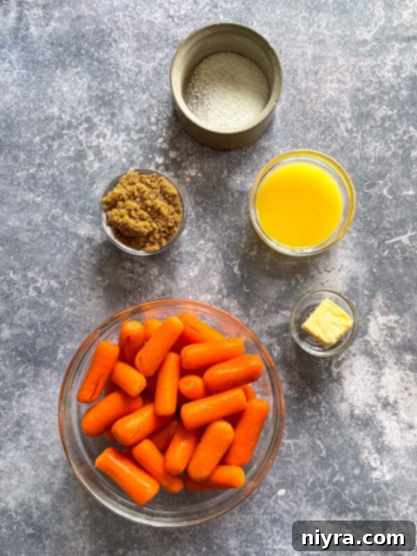 A serving of orange glazed carrots in a white bowl, garnished with fresh thyme, goat cheese, and chopped walnuts.