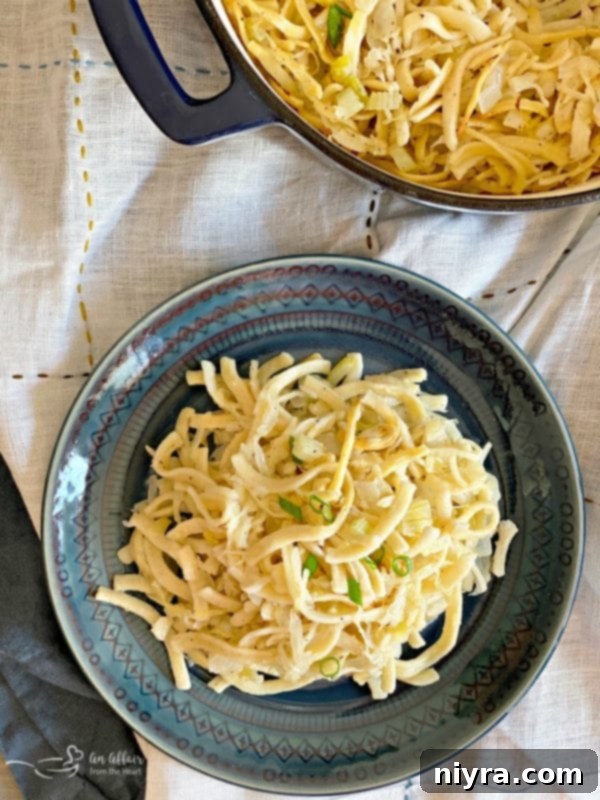 Polish Kluski and Sauerkraut 3 Polish Noodles & Kraut served on a plate - a hearty, meatless dish