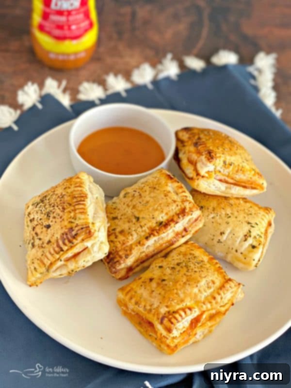 Dorothy's Pizza Pockets - Flaky puff pastry wrapped around pepperoni, cheese, and a sweet and tangy sauce.